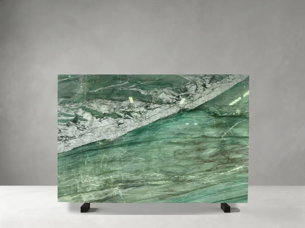 Patagonia Green Quartzite full slab showing emerald, teal, forest green, cream and warm gold tones with large translucent mineral fields crossed by bold white and golden crystalline bands
