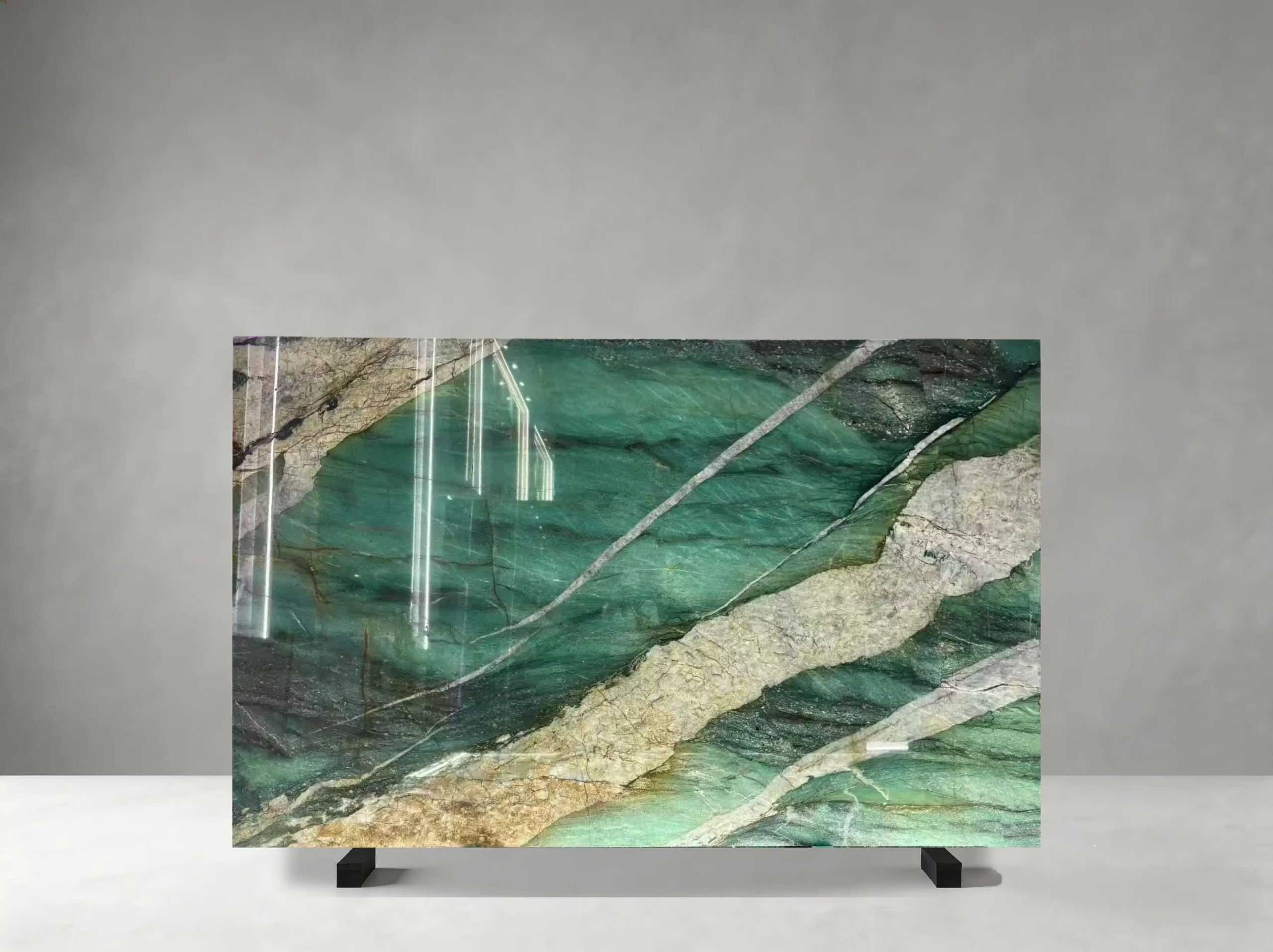 Patagonia Green Quartzite full slab showing emerald, teal, forest green, cream and warm gold tones with large translucent mineral fields crossed by bold white and golden crystalline bands