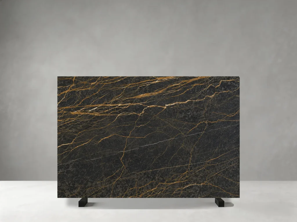 Port Saint Laurent Marble slab with dark chocolate, charcoal and black tones crossed by fine white and golden veins