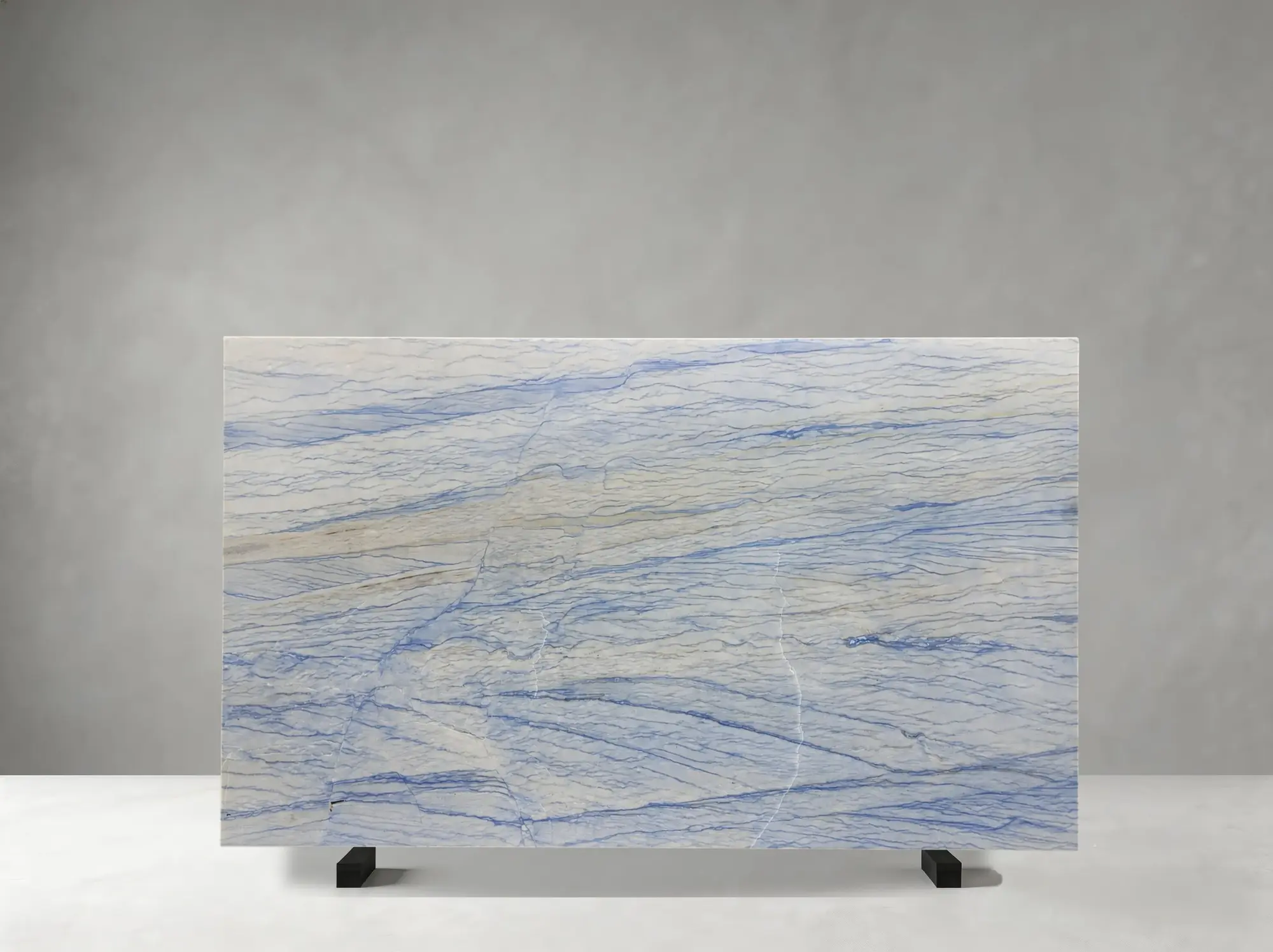 Royal Blue Quartzite polished slab showing a luminous pale-blue field crossed by confident royal-blue bands