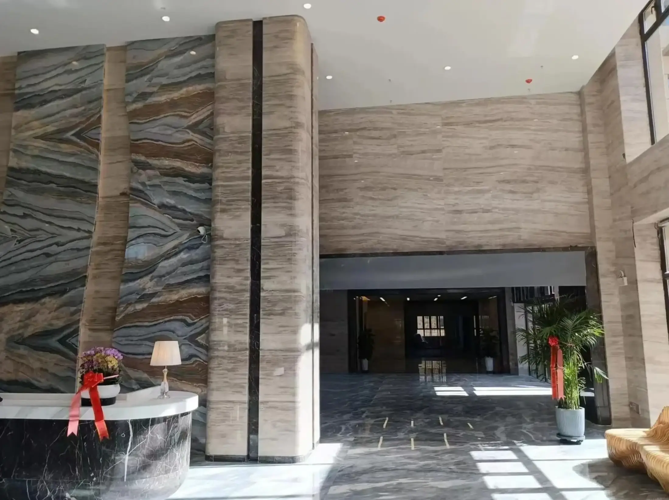 Turkish Daino Marble lobby wall and column cladding with dramatic large format stone panels