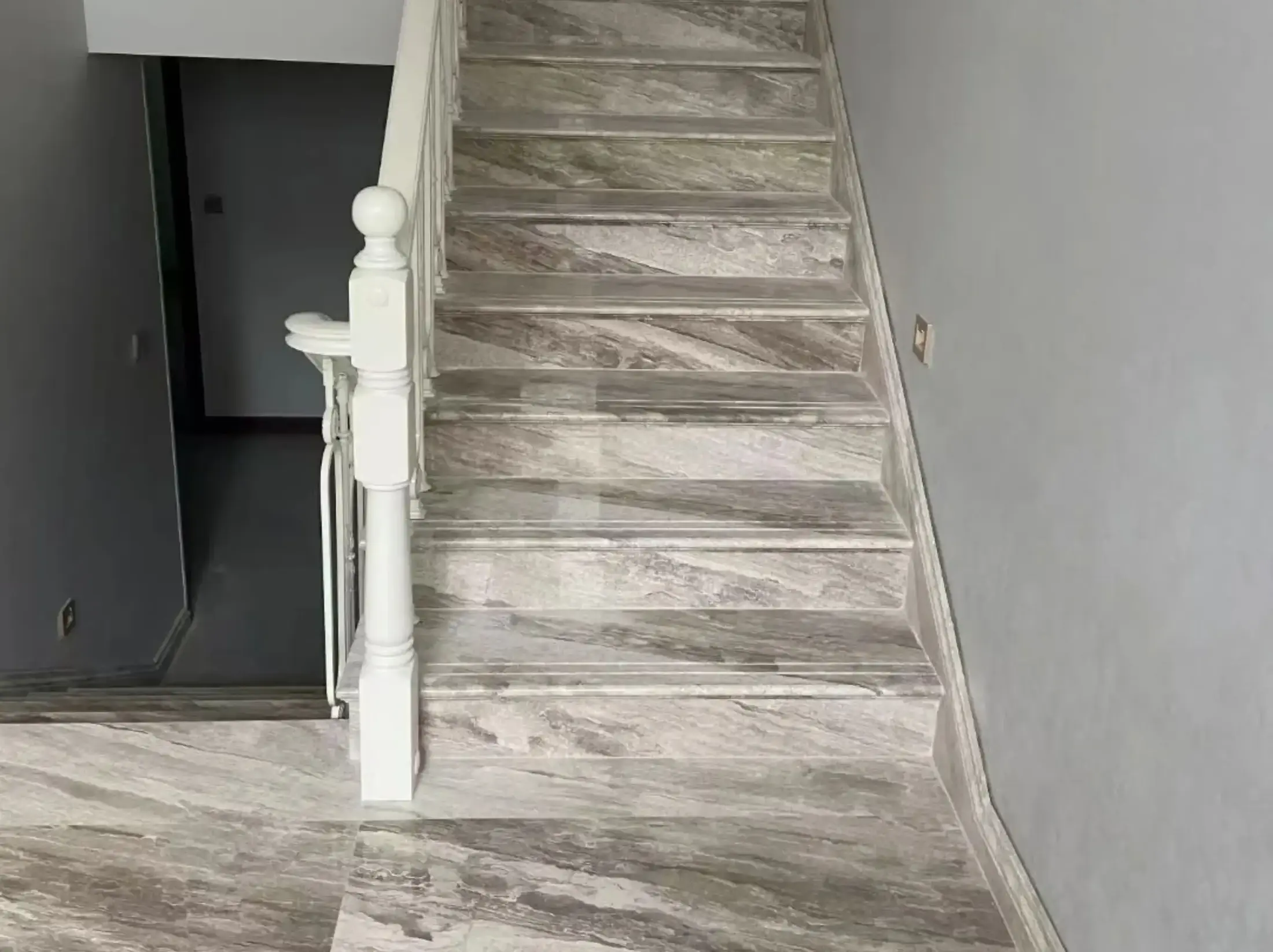 Turkish Daino Marble staircase and landing with coordinated grey beige stone treads and floor