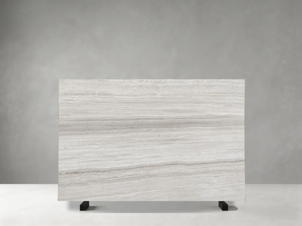 White Wood Grain Marble full slab showing cool white, silver-grey and pale greige tones with parallel linear veins that reproduce the layered rhythm of natural wood grain
