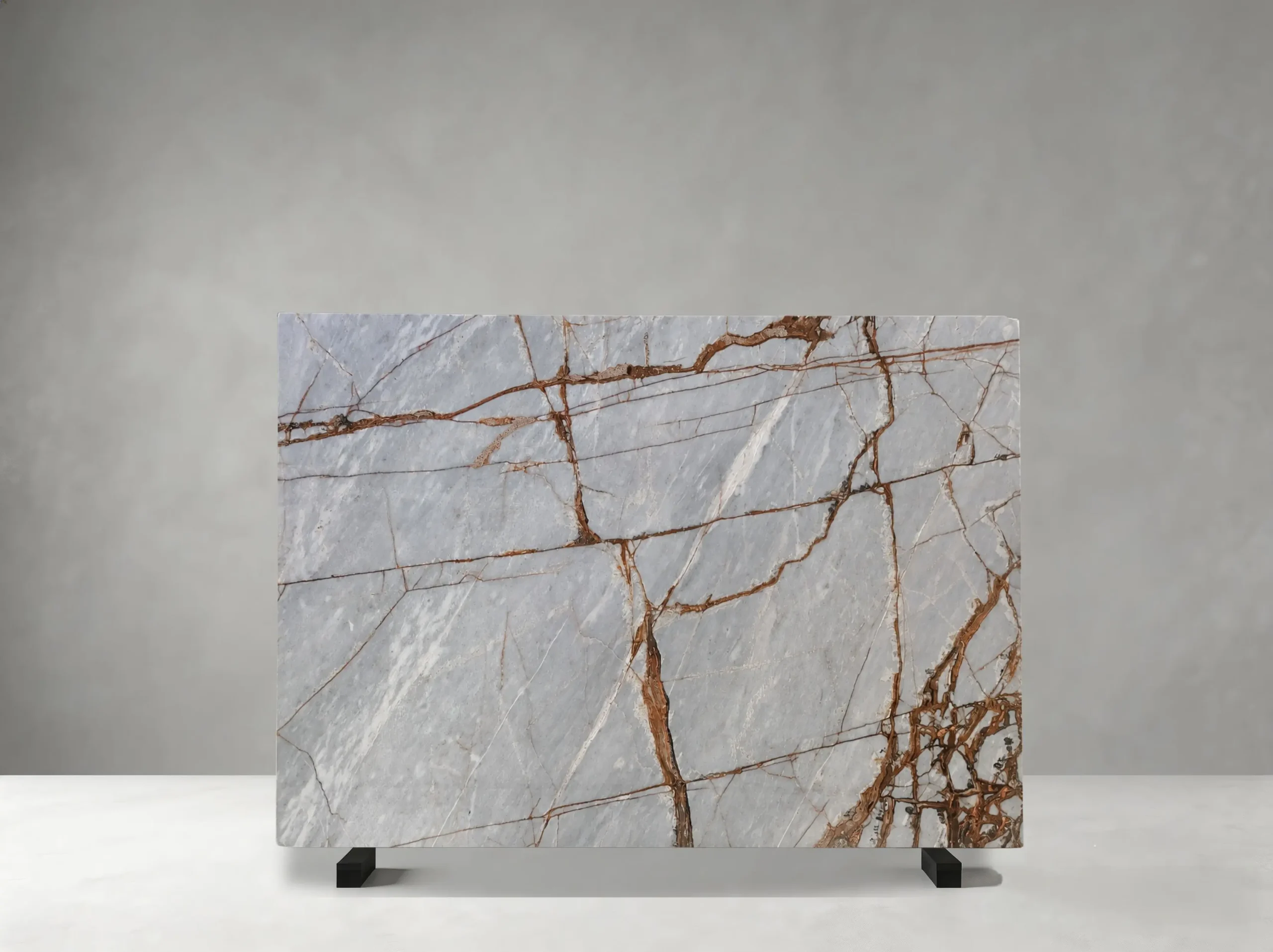 Winter River Marble full slab showing pale blue-grey, silver-white and warm rust tones with branching copper-red veins across broad icy mineral fields