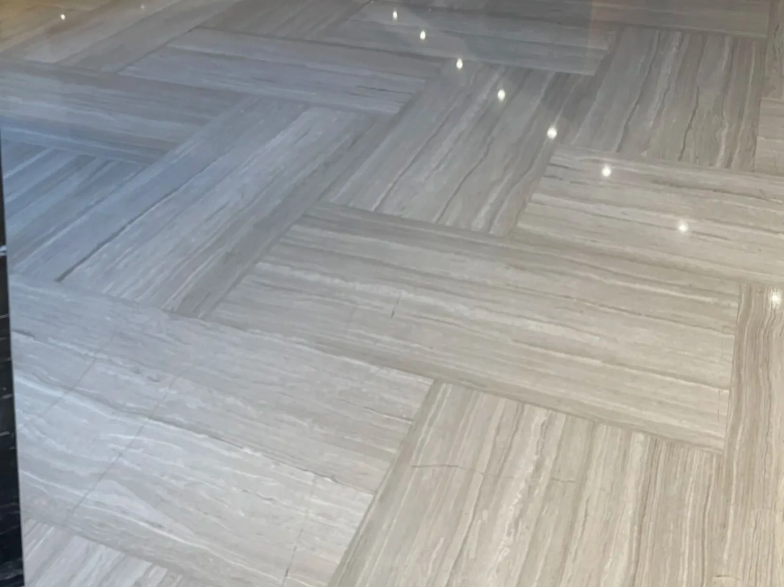 Wooden White Marble herringbone floor tile installation